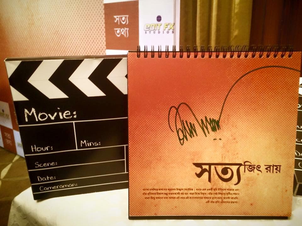 A Satyajit Ray desk calendar and film clapperboard — the kind of collectable that holds the memory of his hand-lettering, which inspired the Ray Roman font project