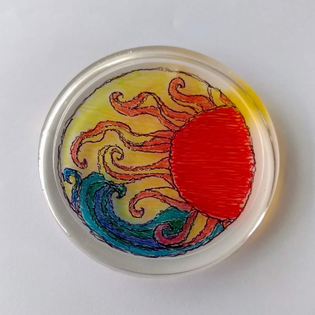 Round resin coaster with a hand-drawn red-orange octopus and teal waves on yellow background
