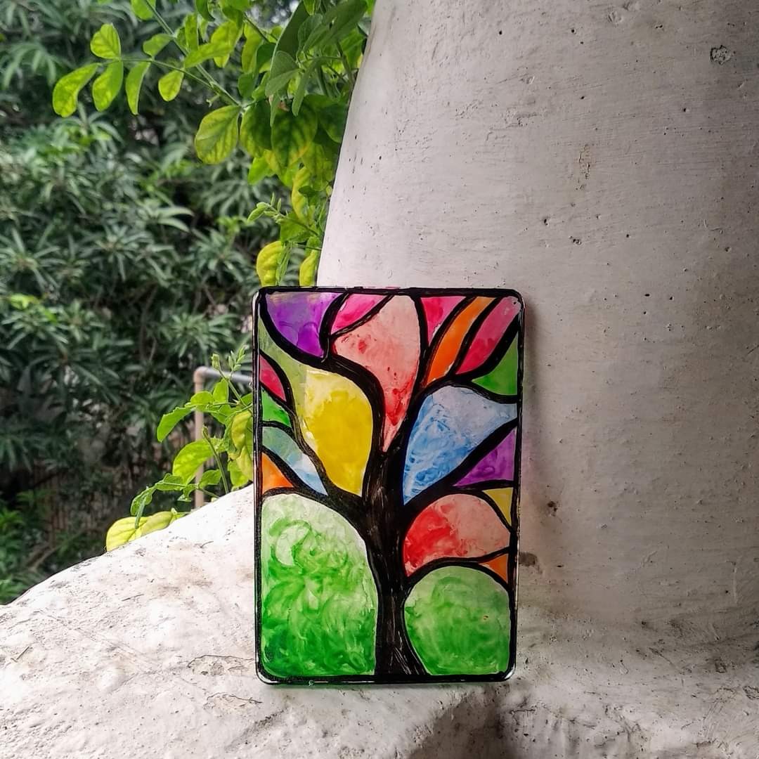Vertical resin slab with stained-glass style tree — multi-coloured canopy panels with black wire outlines